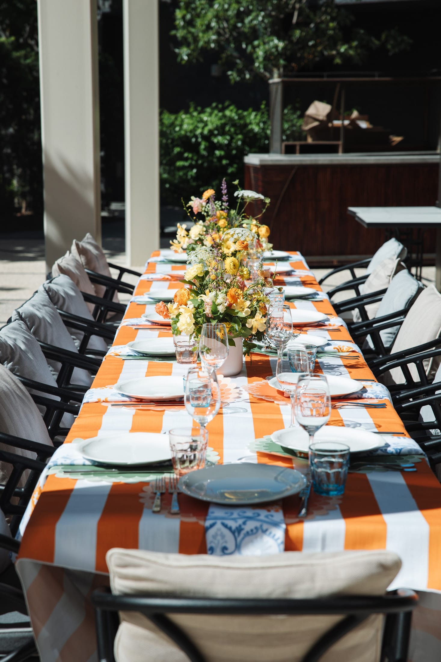 An elegant outdoor banquet table set at a resort
