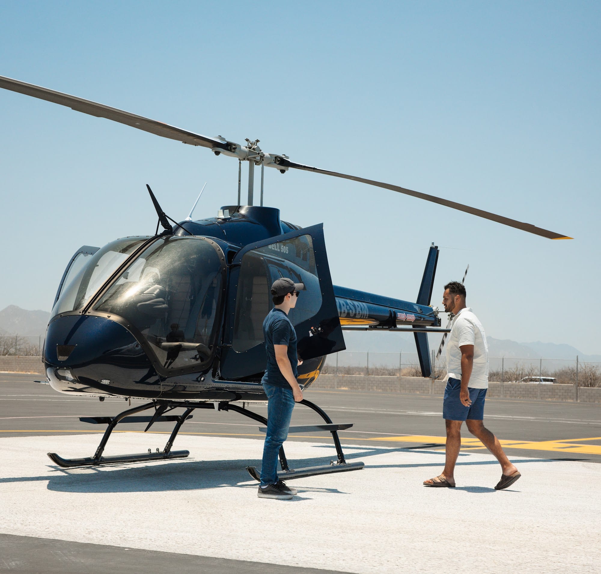 A helicopter on the pad at a luxury resort
