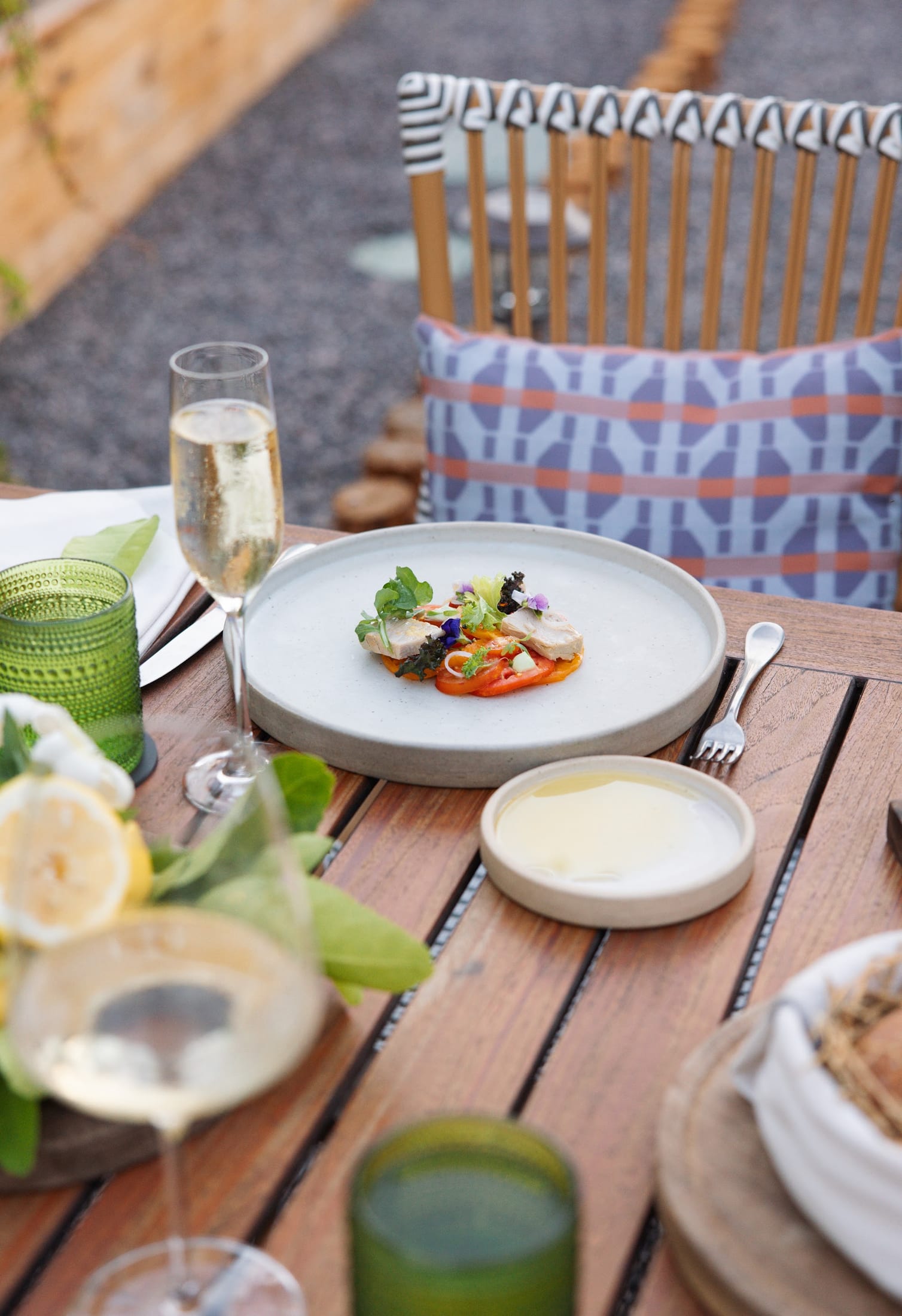 A plated fine-dining dish with champagne