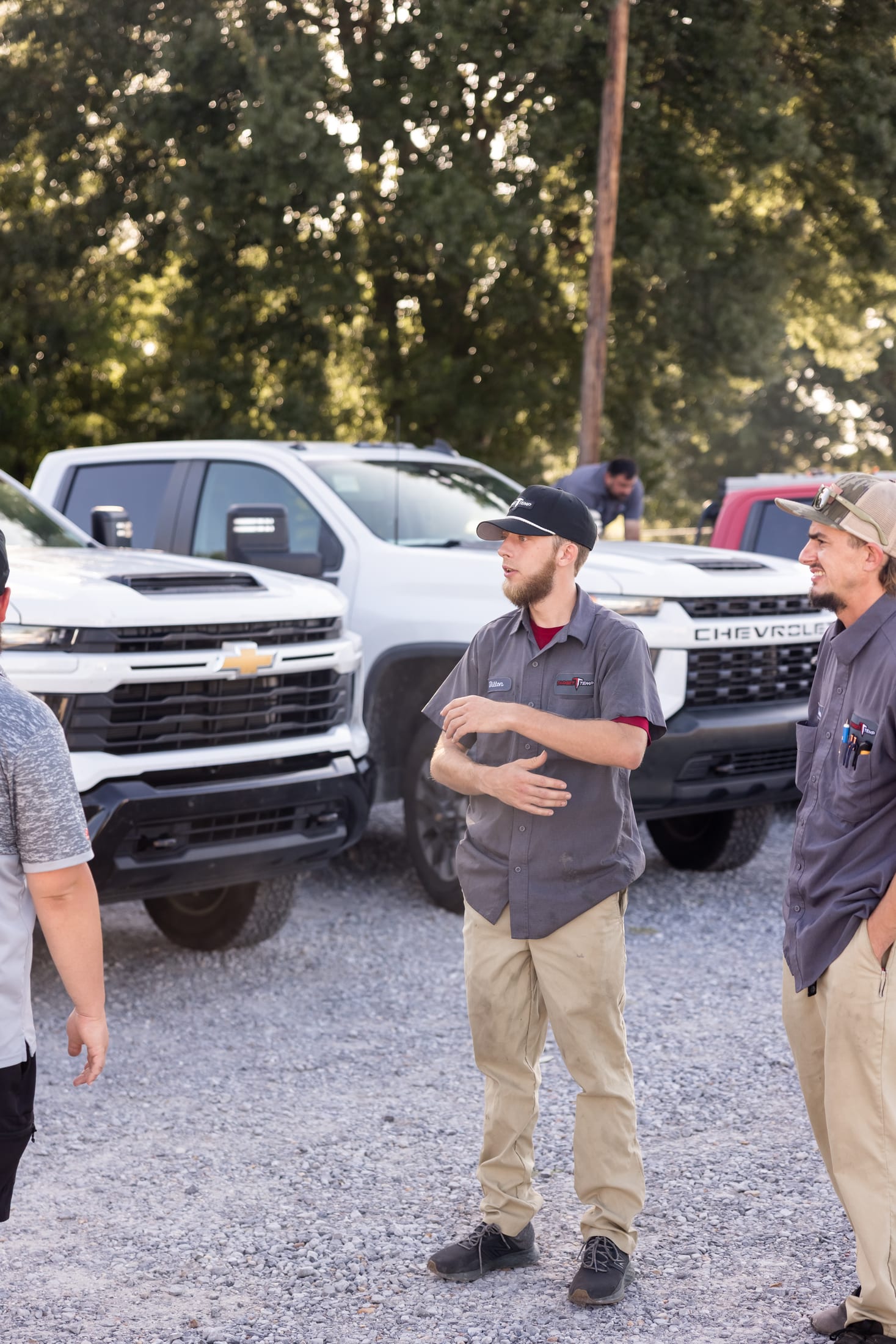A client crew by their trucks, filmed for an ad shoot