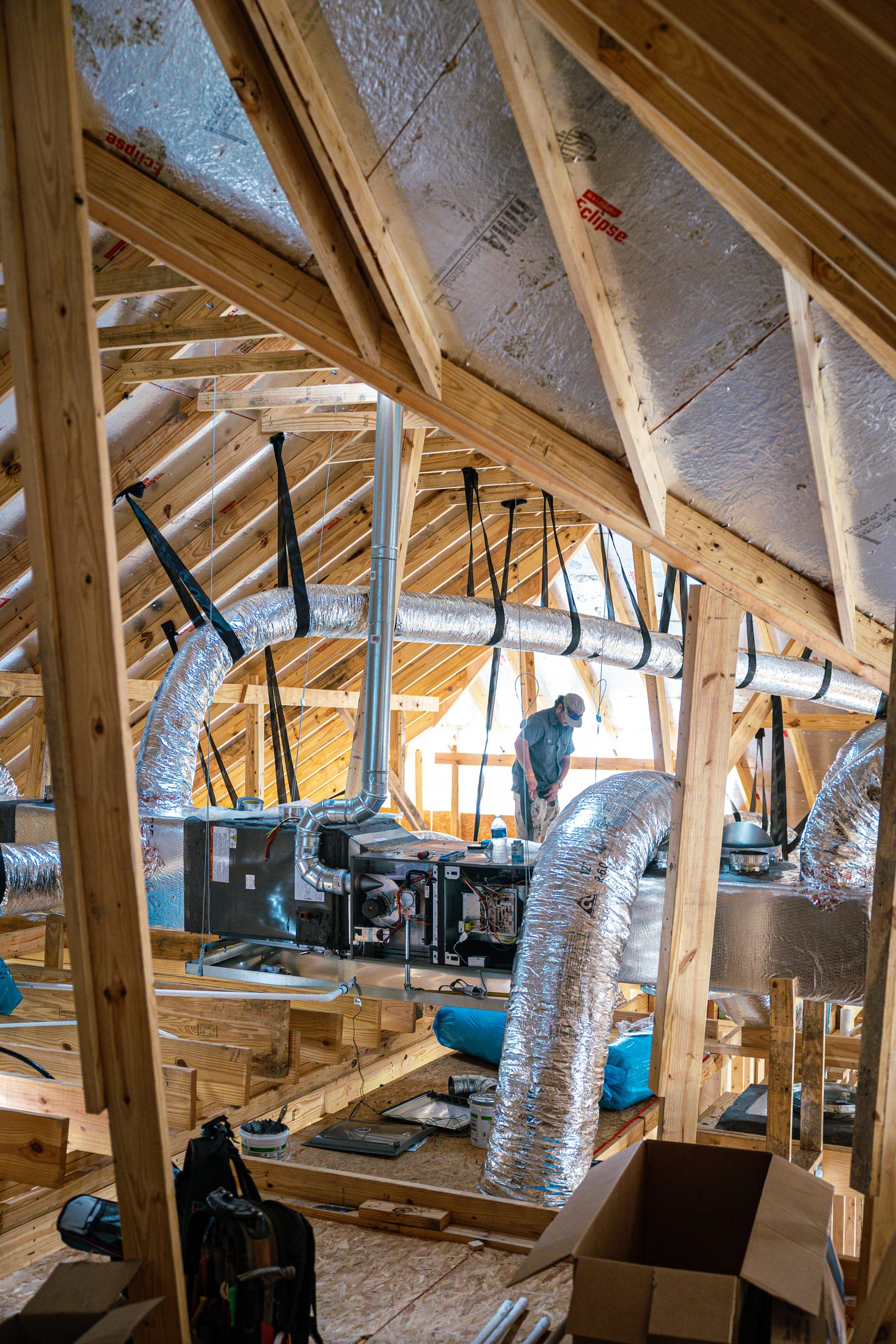A wide shot of an attic HVAC install