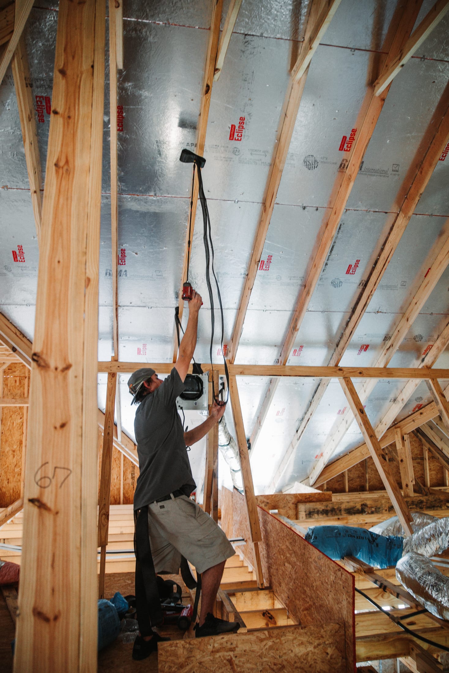 A technician mid-install on an HVAC job